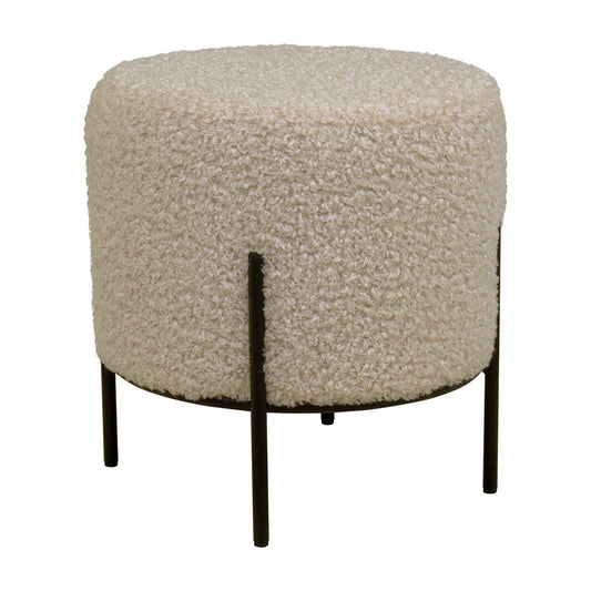 Ronde beige poef met zachte textuur, ondersteund door slanke zwarte metalen poten, elegant en modern ontwerp.