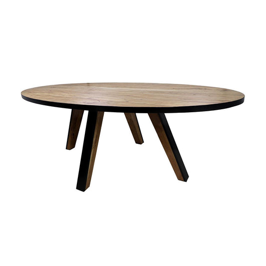 Ronde houten eettafel met een donkere rand en schuin geplaatste zwarte poten, minimalistisch ontwerp.