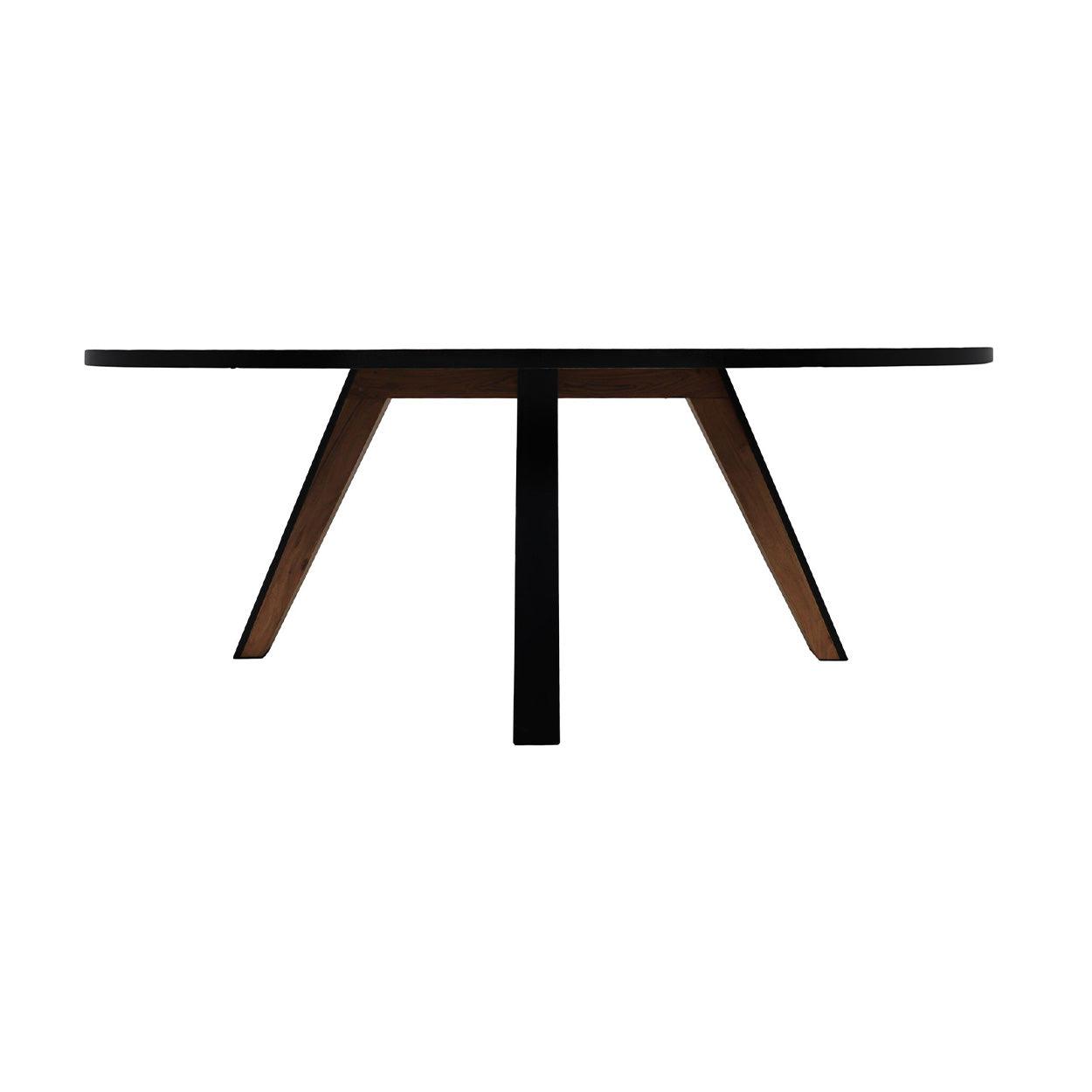 Ronde houten tafel met zwart tafelblad en schuine poten, een modern en minimalistisch ontwerp.