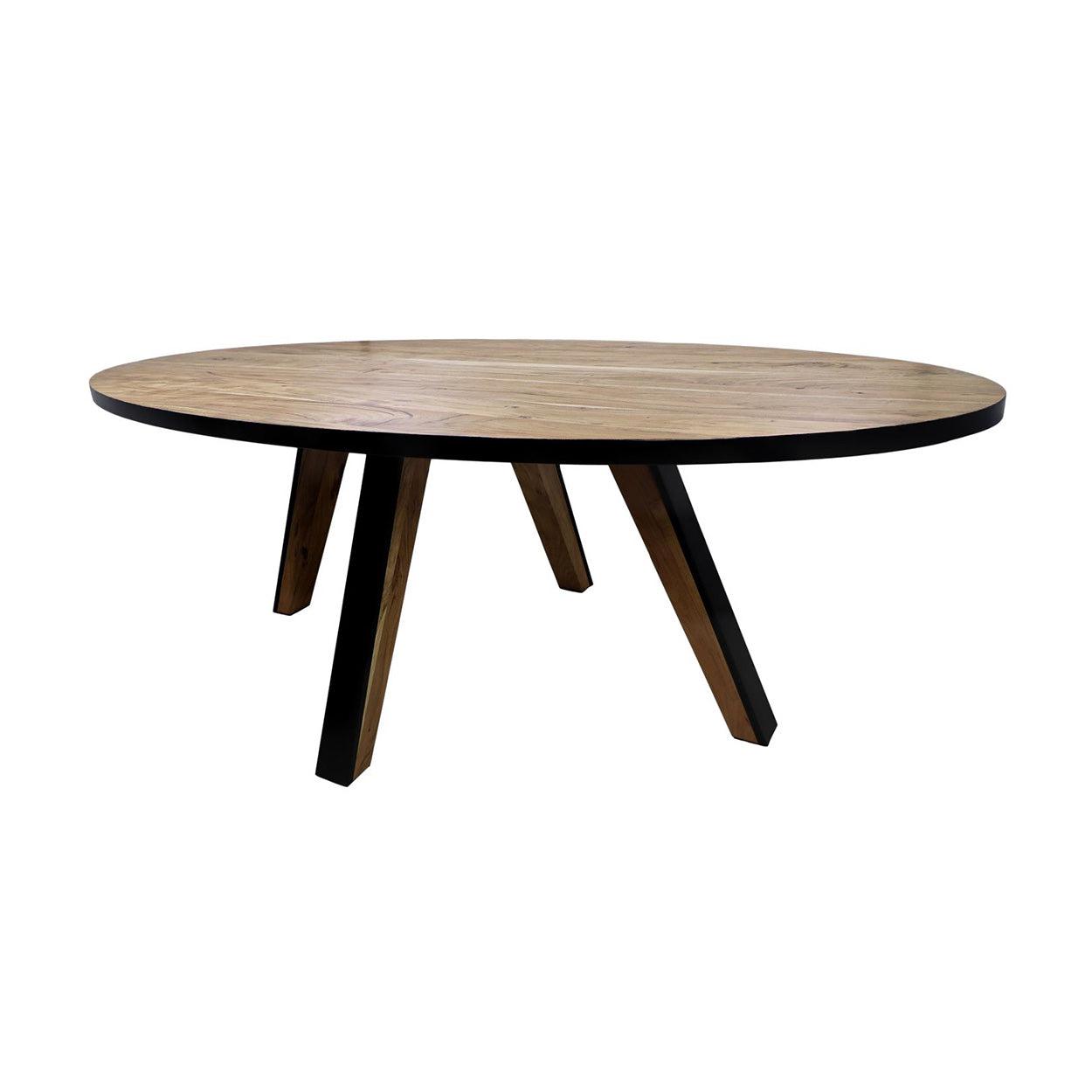 Ronde houten tafel met zwarte accenten en driehoekige poten, minimalistisch design.