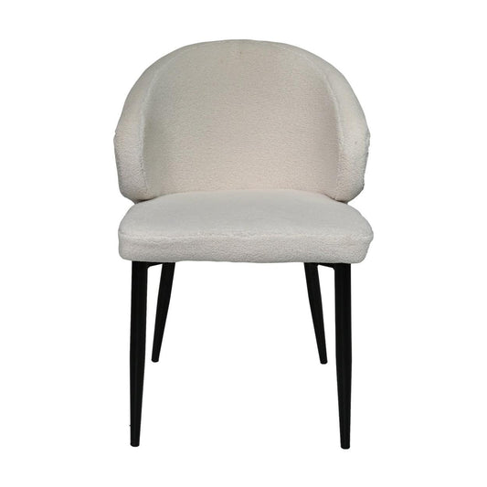 Stijlvolle crèmekleurige stoel met zachte zitting en rugleuning, slanke zwarte poten bieden modern contrast.