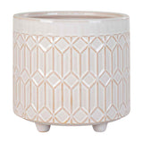 Crèmekleurige keramische pot met geometrisch patroon en drie pootjes, glanzend oppervlak, modern design.
