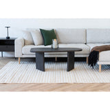 Melo salontafel van House Nordic staat in een moderne zithoek met lichte bank, ribbelkleed en minimalistische decoratie.