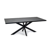 Donkergrijze rechthoekige tafel met marmeren look en zwart metalen stervormige poten.