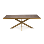 Moderne eettafel met een bronskleurig krasbestendig blad en kruisvormige metalen poten.