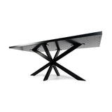 Zwart metalen tafel met een modern ontwerp en geometrisch onderstel op een witte achtergrond.